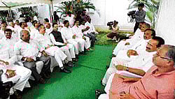 Holding their ground: Outgoing chief minister D V Sadananda Gowda holds a meeting with BJP State unit president K S Eshwarappa, Minister Suresh Kumar and other supporters at his official residence in Bangalore on Tuesday. DH Photo