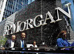 Commuters walk past the JP Morgan headquarters in New York. REUTERS