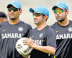 are you ready? Skipper MS Dhoni (left), Gautam Gambhir (centre) and Virat Kohli during training on Monday. pti