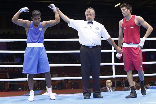Brazil's Yamaguchi Falcao Florentino (L) reacts after defeating India's Sumit Sangwan in the men's Light Heavy (81kg) Round of 32 boxing match at ExCeL venue during the London 2012 Olympic Games July 30, 2012. REUTERS/Murad Sezer