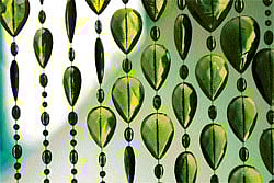 elegant Glass bead curtains are back in vogue. (Below) Beads can be use to make coasters or doilies too. getty images