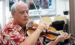 Violinist: Paul Peabody rehearsing a piece.