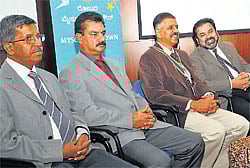 for industries: Rotary Mysore Midtown president R S Vishwanath shares a lighter moment with Prof S Venkatesan in Mysore on Wednesday. N Narendra, L M Manoj Kumar and Dr K A Prahlad are seen. dh photo