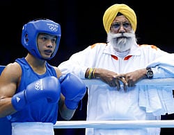 India's Devendro Singh Laishram waits in his corner during his Men's Light Fly (49kg) quarter-final boxing match against Ireland's Paddy Barnes at the London Olympic Games August 8, 2012. REUTERS