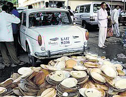 In their own mess: The plates thrown by protesting BBMP staff and members of Palike Workers Federation on the BBMP premises added to the piles of garbage in the City on  Thursday.  DH Photo