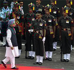 Prime Minister Manmohan Singh inspects guard of honour before addressing the nation on 66th Independence Day in New Delhi on Wednesday. PTI Photo