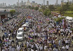 Activists from the Maharashtra Navnirman Sena (MNS) walk down Marine Drive during a protest rally in Mumbai August 21, 2012. Thousands of activists held the rally to protest against a violent riot that took place in Mumbai on August 11 and against the illegal immigration of Bangladeshis into India, local media reported on Tuesday. REUTERS/Vivek Prakash