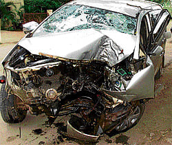 crushed: Mangled remains of a car that rammed a tree at Mandya Tuesday. DH Photo