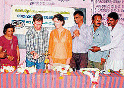 Manager of ODP Robin Pern inaugurates 250 tap connections and 58 toilets provided to residents of Bisalavadi in Chamarajanagar taluk on Friday.