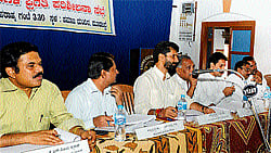 ENSURING PROGRESS: (Left) District-in-Charge Minister C T Ravi chairing a taluk-level review meet in Moodbidri on Tuesday. Deputy Commissioner Dr N S Channappa Gowda and ZP CEO Dr K N Vijayprakash among others look on. (Top) The officials taking part in the meet. DH PHOTOS