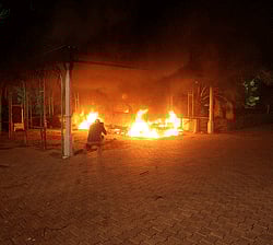 A vehicle and the surrounding area are engulfed in flames after it was set on fire inside the US consulate compound in Benghazi late on September 11, 2012. An armed mob protesting over a film they said offended Islam, attacked the US consulate in Benghazi and set fire to the building, killing one American, witnesses and officials said. AFP PHOTO
