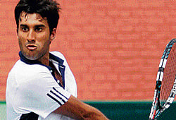 poised to strike: Yuki Bhambri en route his win over New Zealands Jose Statham during his singles match in Chandigarh on Sunday. AFP