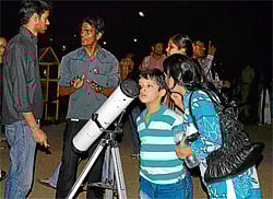 space view People take a closer look at Earths natural satellite on Observe the Moon Night.