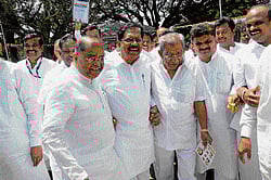 bonhomie: KPCC president G Parameshwara, treasurer Shamanur Shivashankarappa and Congress leader K C Kondaiah arrive at the Palace Grounds in Bangalore to attend the general body meeting on Wednesday. dh photo