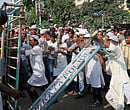 Protestors break the police cordon during a demonstration against anti-Islam film in front of American Center in Kolkata on Thursday. PTI