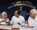 Union Ministers P Chidambaram, Kapil Sibal and Salman Khurshid addressing a press conference in New Delhi on Friday. PTI