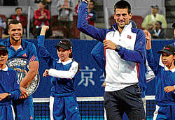 a dance to remember Novak Djokovic grooves to the hugely popular hit single Gangnam Style after winning the China Open in Beijing on Sunday. AFP