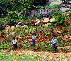 Students and teachers in the midst of the garden of the government primary school at  Shivalinga village near Kolar Gold Fields. dh photo