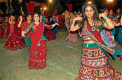 devotional In a unique form of Garba, dancers balance fire pots in their hands.