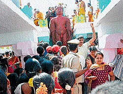 Ceremony: Devotees make a beeline to witness mastakabhisheka of Lord Bahubali at Gommatagiri, Hunsur taluk,  in Mysore district on Sunday. dh photo