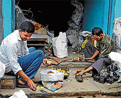 At work A scrap dealer segregating electronic waste.