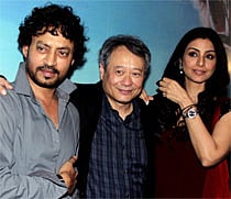 Indian Bollywood actress Tabu (R) and actor Irfan Khan (L) pose during a promotional event for the forthcoming English film Life of Pi directed by Hollywood Oscar-winner Ang Lee (C) in Mumbai late October 29, 2012. AFP PHOTO