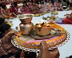Patna: Punjabi women perform prayers during 'Karva-Chauth' festival in Patna on Friday. PTI Photo
