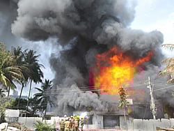 Thick smoke arising out of a Berger paints godown at Garvepalya in Bangalore on Thursday. Photo Srikanta Sharma R.