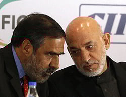 Afghanistan President Hamid Karzai (R) with Commerce Minister Anand Sharma in Mumbai on Saturday. REUTERS