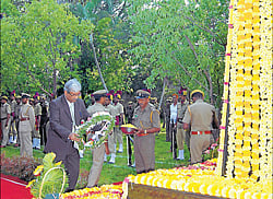 Principal district and sessions court judge Mohan Sripada Sankolli lays wreath on Forest Martyrs memorial in Mysore on Saturday. dh photo
