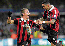 ECSTATIC: AC Milan's Philippe Mexes (left) celebrates with team-mate Kevin-Prince Boateng after scoring against Anderlecht in the Champions League on Wednesday. REUTERS