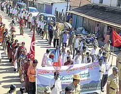 Inam land victims takes out a procession in Kalasa town on Monday.