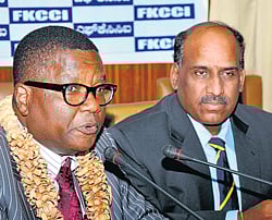 Budding relationship: Kenyan Assistant Minister of Higher Education, Dr M P Kilemi Mwiria, speaks at the interactive session in Bangalore on Monday. FKCCI president K Shiva Shanmugam is with him. DH photo