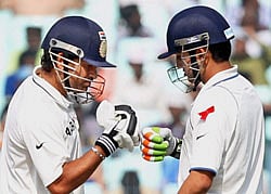 Gautam Gambhir is greeted by Sachin Tendulkar on completing his half century during 3rd India-England cricket test match at Eden Garden in Kolkata on Wednesday. PTI