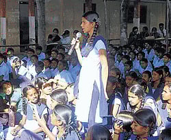 seeking reply: A student asks questions at the Makkala Gram Sabha organised at Government High School in Melur, Shidlaghatta taluk, recently. dh photo