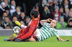 TOUGH GUYS: Against all odds, a spirited Celtic sealed their place among the elite 16 in Europes top-club competition. REUTERS