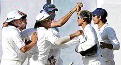 morale boosting: A jubilant Karnataka team celebrate their victory over Delhi on Tuesday. dh photo/ srikanta sharma