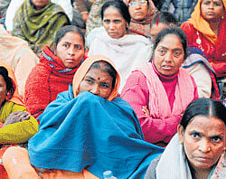 Residents of Kotkasim in Rajasthan, stage a protest against the cash subsidy transfer scheme in New Delhi. AFP