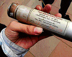 A protester shows the expired tear gas shell fired by police on Sunday.
