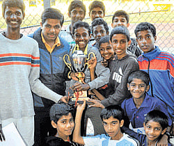 Delighted bunch: St Josephs Indian High School team members, who won the boys overall title, pose with the trophy at the Sree Kanteerava Stadium on Sunday.  dh photo