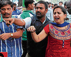 GRIEVING: Bhagya, wife of Shankar (inset), who was  murdered in his office at Vidyapeeta Circle in the City  on Saturday. DH File Photo