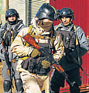 An Afghan special forces soldier (C) takes position during an attack on the Afghan police headquarters in Kabul on Monday. AfP