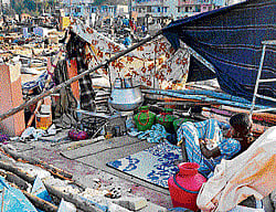The belongings of the slum dwellers of Ejipura lay scattered after BBMP demolished their shanties in a special drive on Monday. dh photo
