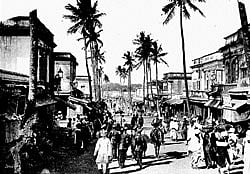 CITYSCAPES A bustling street in the Bangalore of yore. (Left) A vendor of sweets. PHOTO COURTESY: JANE SMITH AND JONES EBINESAN