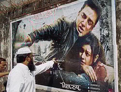 Protestors tearing a poster of Kamal Haasan's controversial movie Vishwaroopam in Mumbra, Mumbai on Friday. PTI