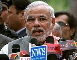 New Delhi: Chief Minister of Gujarat, Narendra Modi addressing media after meeting the Prime Minister Manmohan Singh in New Delhi on Wednesday. PTI Photo