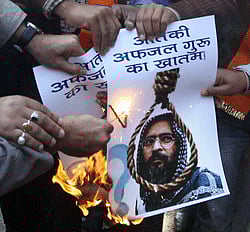 Bajrang Dal activists celebrate the hanging of Parliament attack convict Afzal Guru, at a rally in Jantar Mantar in New Delhi on Saturday. PTI Photo