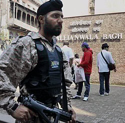 Punjab Police personnel deployed for the security of British Prime Minister David Cameron outside Jallianwala Bagh, in Amritsar on Tuesday. PTI Photo