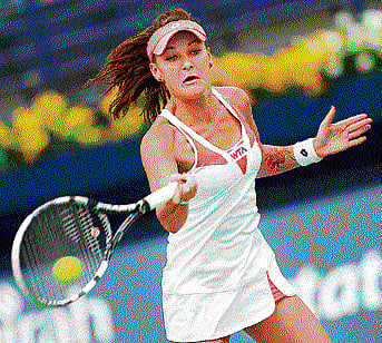 POWER PACKEd: Poland's Agnieszka Radwanska returns to Kazakhstan's Yulia Putintseva  in the WTA Dubai tennis championships on Wednesday. AFP