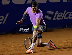 Rafael Nadal of Spain hits a return to Diego Sebastian Schwartzman of Argentina during their men's singles match at the Mexican Open tennis tournament in Acapulco February 26, 2013. REUTERS